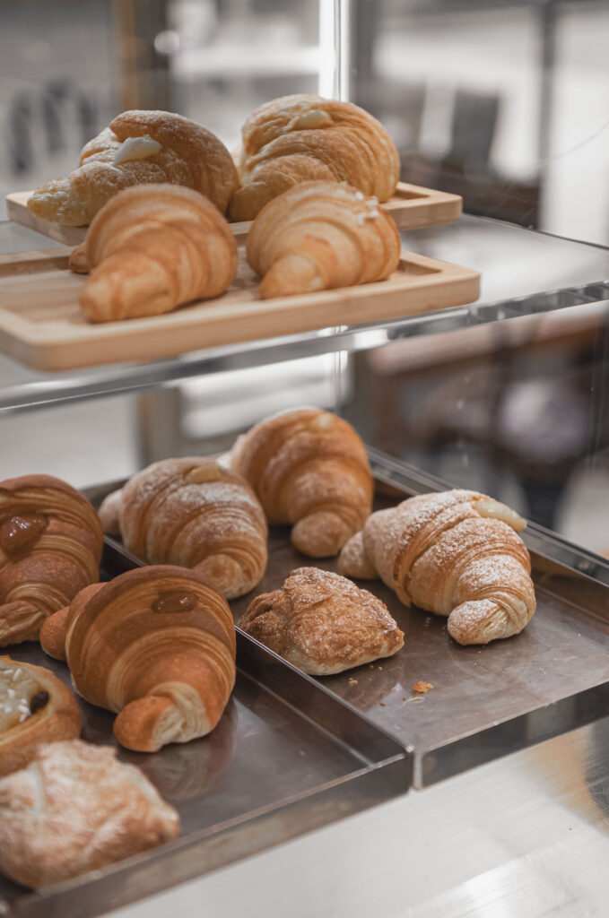 Fresh croissants in a bakery display case — the scent of baking is one of the simplest ways to boost creativity and spark new ideas